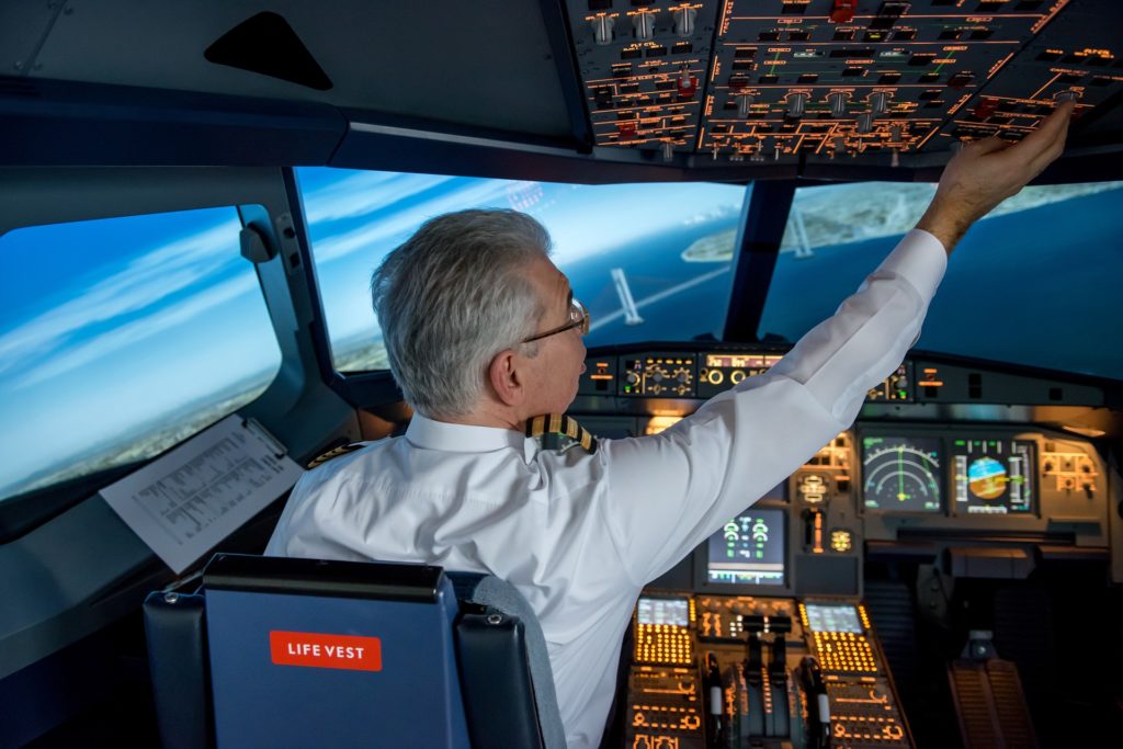 commercial airplane pilot in cockpit