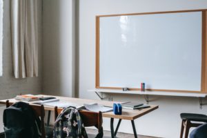 white board and desk in a classroom