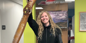 High Flight Academy instructor, Desiree, holding our honorary propeller as she moves on in her career.