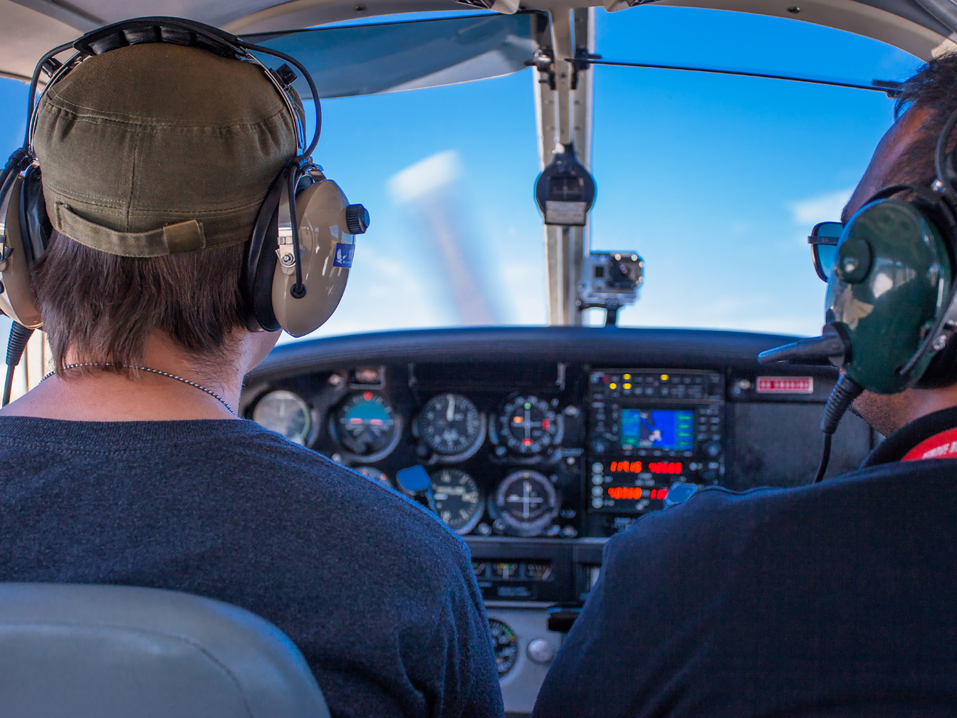 Student pilot getting in flying time with an instructor to earn a private pilot certificate. High Flight Academy.